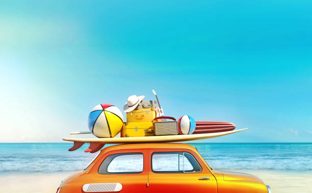 Orange car at shoreline with beach items on its roof